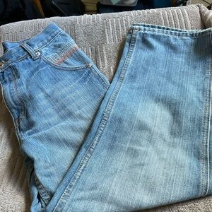 Roca wear light wash jeans with colorful pockets